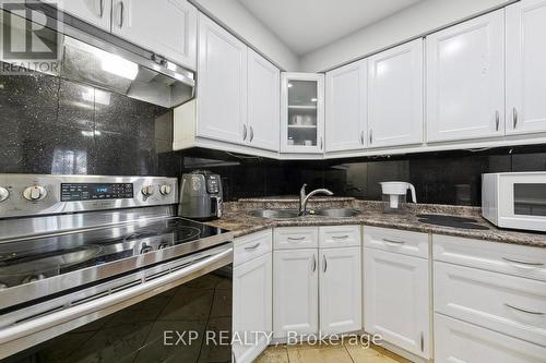 59 - 3025 Cedarglen Gate, Mississauga, ON - Indoor Photo Showing Kitchen With Double Sink