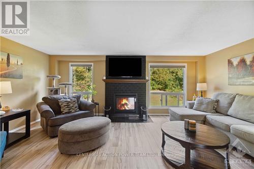 6593 Bilberry Drive, Ottawa, ON - Indoor Photo Showing Living Room With Fireplace