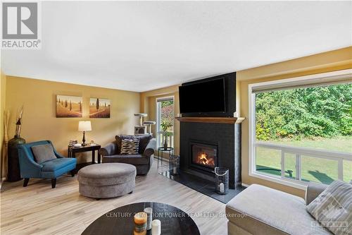 6593 Bilberry Drive, Ottawa, ON - Indoor Photo Showing Living Room With Fireplace