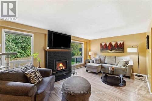 6593 Bilberry Drive, Ottawa, ON - Indoor Photo Showing Living Room With Fireplace