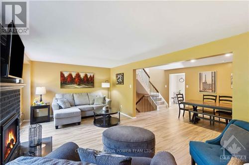 6593 Bilberry Drive, Ottawa, ON - Indoor Photo Showing Living Room With Fireplace