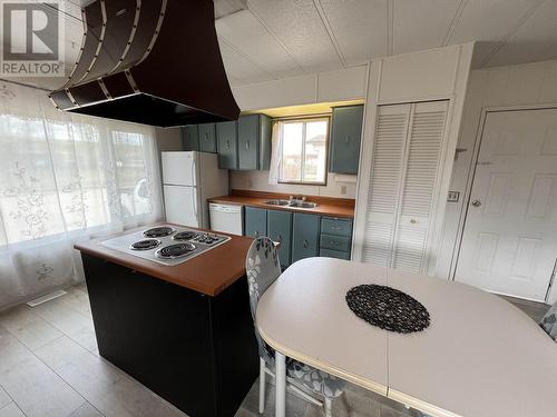 31 4501 Nahanni Drive, Fort Nelson, BC - Indoor Photo Showing Kitchen With Double Sink