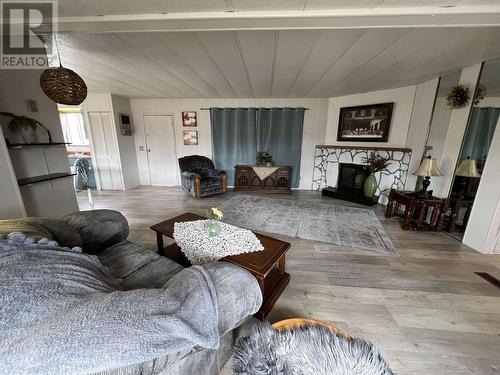 31 4501 Nahanni Drive, Fort Nelson, BC - Indoor Photo Showing Living Room With Fireplace