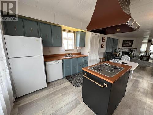 31 4501 Nahanni Drive, Fort Nelson, BC - Indoor Photo Showing Kitchen With Double Sink