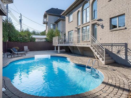 Pool - 8 Rue Fleming, Dollard-Des-Ormeaux, QC - Outdoor With In Ground Pool With Deck Patio Veranda With Exterior