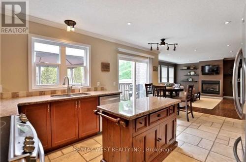 23 Baggs Crescent, Cambridge, ON - Indoor Photo Showing Kitchen With Fireplace With Double Sink