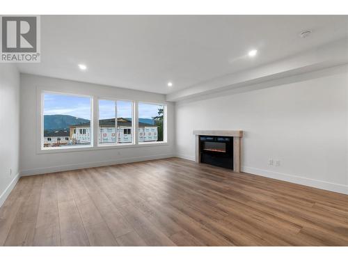 981 12 Street Se Unit# 30, Salmon Arm, BC - Indoor Photo Showing Living Room With Fireplace