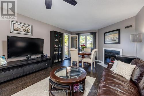 320 - 193 Lake Driveway W, Ajax (South West), ON - Indoor Photo Showing Living Room With Fireplace