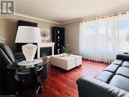 12021 Highway 17 E, Sturgeon Falls, ON - Indoor Photo Showing Living Room With Fireplace