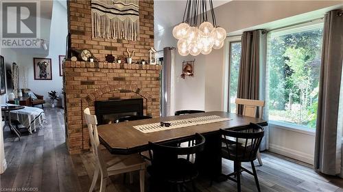 64 Boiler Beach Road, Huron-Kinloss, ON - Indoor Photo Showing Dining Room With Fireplace