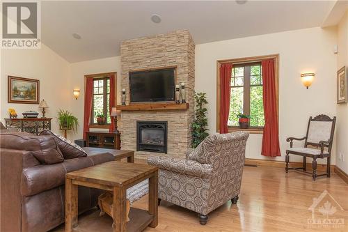 2450 River Road, Ottawa, ON - Indoor Photo Showing Living Room With Fireplace