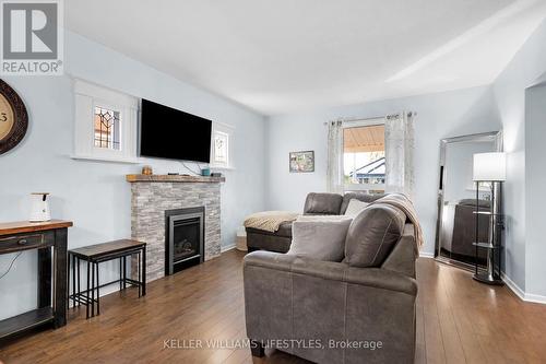 Family room with gas fireplace - 76 Connaught Avenue, London, ON - Indoor Photo Showing Living Room With Fireplace