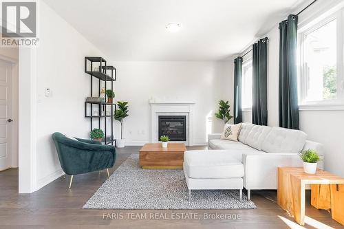 102 Wood Crescent, Essa, ON - Indoor Photo Showing Living Room With Fireplace