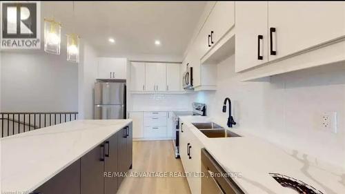 87 - 3900 Savoy Street, London, ON - Indoor Photo Showing Kitchen With Stainless Steel Kitchen With Double Sink With Upgraded Kitchen