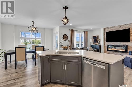 2070 Stilling Lane, Saskatoon, SK - Indoor Photo Showing Kitchen With Fireplace With Double Sink