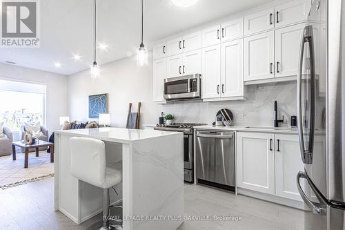 302 - 3265 Carding Mill Trail, Oakville, ON - Indoor Photo Showing Kitchen With Stainless Steel Kitchen With Upgraded Kitchen