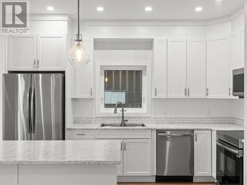 43 Eugene Avenue, Whitehorse, YT - Indoor Photo Showing Kitchen With Double Sink With Upgraded Kitchen