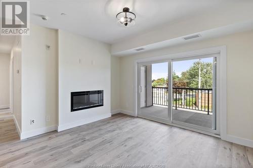 7887 Edgar Unit# 305, Windsor, ON - Indoor Photo Showing Living Room With Fireplace