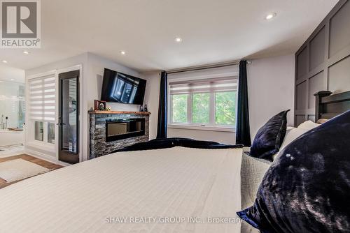 10 Clover Avenue, Cambridge, ON - Indoor Photo Showing Bedroom With Fireplace