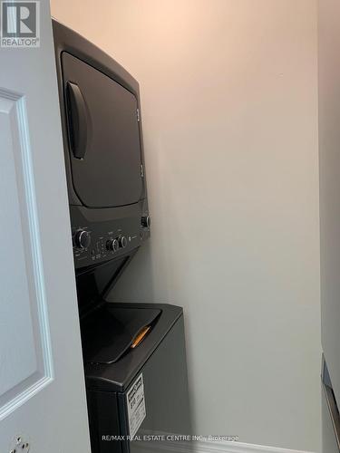 Ph708 - 1001 Cedarglen Gate, Mississauga, ON - Indoor Photo Showing Laundry Room