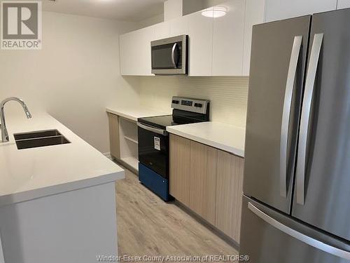 3320 Stella Crescent Unit# 309, Windsor, ON - Indoor Photo Showing Kitchen With Stainless Steel Kitchen With Double Sink With Upgraded Kitchen