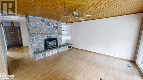 309 Echo Bay Road, Huntsville, ON - Indoor Photo Showing Living Room With Fireplace