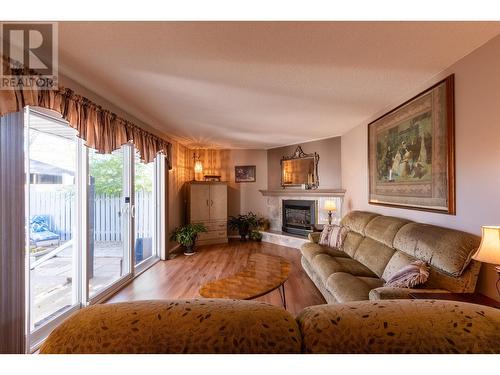 149 111 S Tabor Boulevard, Prince George, BC - Indoor Photo Showing Living Room With Fireplace