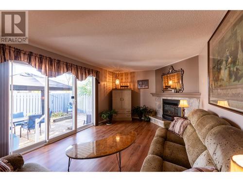 149 111 S Tabor Boulevard, Prince George, BC - Indoor Photo Showing Living Room With Fireplace