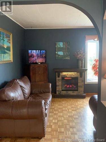 103 Lavigne Lane, Dalhousie, NB - Indoor Photo Showing Living Room With Fireplace