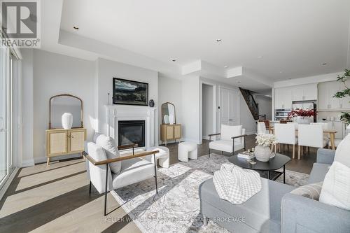 2 - 325 Lakebreeze Drive, Clarington (Newcastle), ON - Indoor Photo Showing Living Room With Fireplace