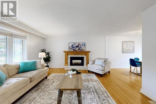 690 Adelaide Avenue E, Oshawa, ON - Indoor Photo Showing Living Room With Fireplace