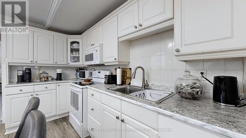 23 Failsworth Avenue, Toronto, ON - Indoor Photo Showing Kitchen With Double Sink