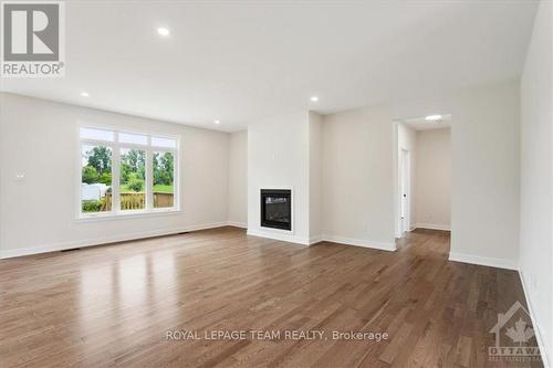 46 Tennant Drive, Rideau Lakes, ON - Indoor Photo Showing Living Room With Fireplace