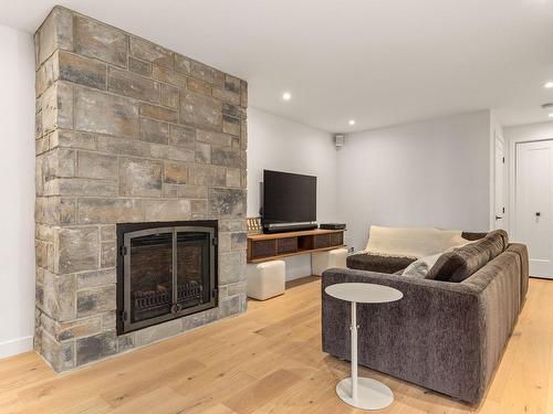 Basement - 165 Rue De Rouville, Bromont, QC - Indoor Photo Showing Other Room With Fireplace