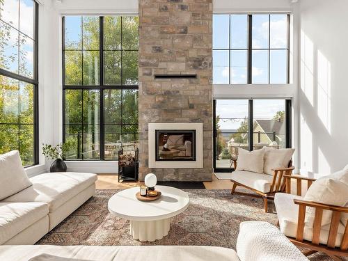 Living room - 165 Rue De Rouville, Bromont, QC - Indoor Photo Showing Living Room With Fireplace