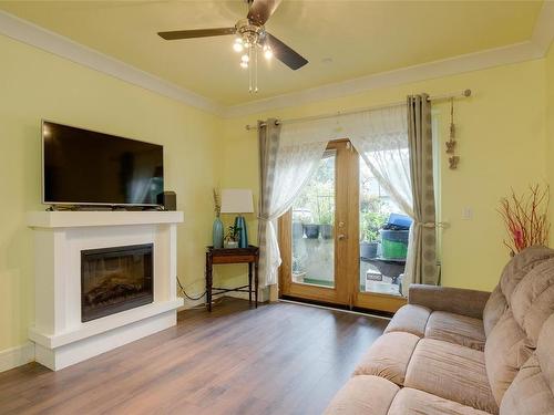 103-2732 Matson Rd, Langford, BC - Indoor Photo Showing Living Room With Fireplace