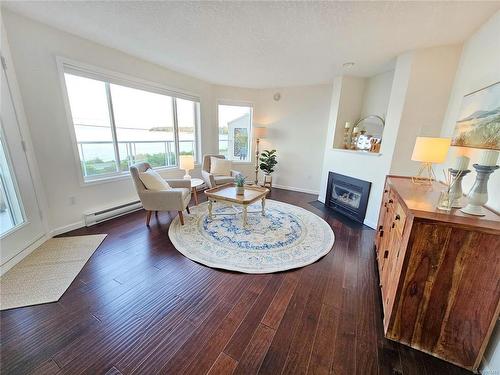 103-3156 Island Hwy West, Qualicum Beach, BC - Indoor Photo Showing Living Room With Fireplace