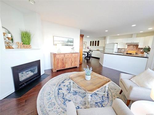 103-3156 Island Hwy West, Qualicum Beach, BC - Indoor Photo Showing Living Room With Fireplace