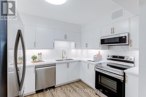 204 - 39 Kimbercroft Court, Toronto, ON - Indoor Photo Showing Kitchen With Upgraded Kitchen