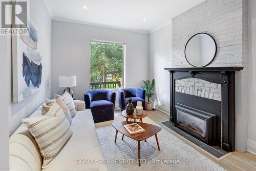 11 Bertmount Avenue, Toronto, ON - Indoor Photo Showing Living Room With Fireplace