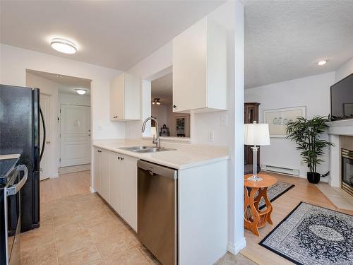 212-898 Vernon Ave, Saanich, BC - Indoor Photo Showing Kitchen With Fireplace With Double Sink