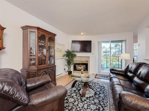 212-898 Vernon Ave, Saanich, BC - Indoor Photo Showing Living Room With Fireplace