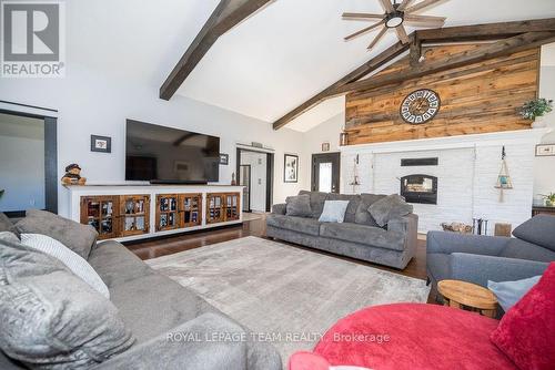 3033 Mclaughlin Road, Whitewater Region, ON - Indoor Photo Showing Living Room With Fireplace