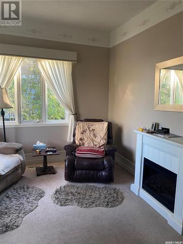 120 Pearson Street, Earl Grey, SK - Indoor Photo Showing Living Room With Fireplace