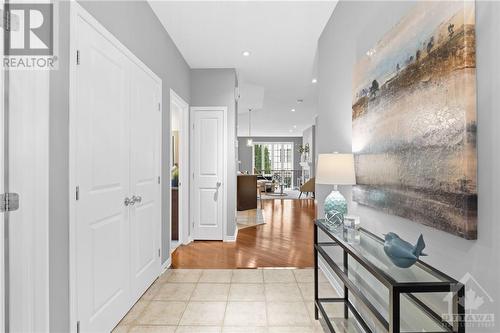 Welcoming hallway with tile flooring, and a clear view leading to a bright, open-concept living area. - 316 Eckerson Avenue, Ottawa, ON - Indoor Photo Showing Other Room