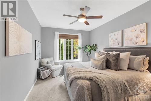 Cozy bedroom with large windows, neutral tones, that create a serene and inviting atmosphere for relaxation. - 316 Eckerson Avenue, Ottawa, ON - Indoor Photo Showing Bedroom