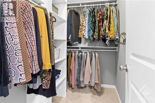 Spacious walk-in-closet off the primary bedroom with lots of storage room and areas to hang up your clothes and keep everything organized. - 316 Eckerson Avenue, Ottawa, ON - Indoor With Storage