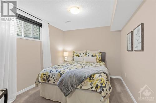 Bright and cozy bedroom with soft lighting, coming in from the window creating a comfortable and inviting atmosphere for rest. - 316 Eckerson Avenue, Ottawa, ON - Indoor Photo Showing Bedroom