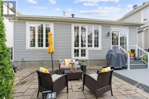 Charming backyard patio area, and lush greenery, providing a perfect spot for outdoor dining and relaxation. - 316 Eckerson Avenue, Ottawa, ON - Outdoor With Deck Patio Veranda With Exterior