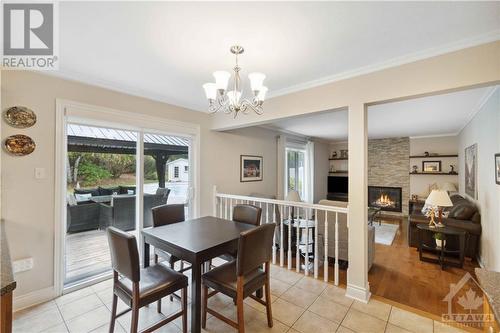 8 Spindle Way, Stittsville, ON - Indoor Photo Showing Dining Room With Fireplace